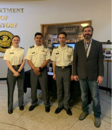 Cadets of the Guatemalan Genocide Mapping Team on Projects' Day 2023. Pictured from left to rights are Cadets Katherine Meyers, Leonel Martinez, Jackson Grefe, and Dr. Michael Cangemi.